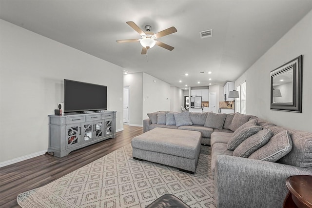 living room with ceiling fan and light wood-type flooring