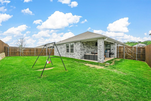 back of house with a yard, an outdoor hangout area, and a patio area