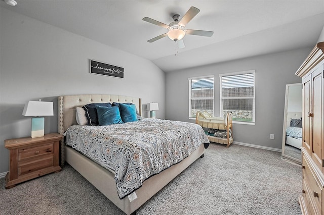 bedroom with vaulted ceiling, ceiling fan, and carpet flooring