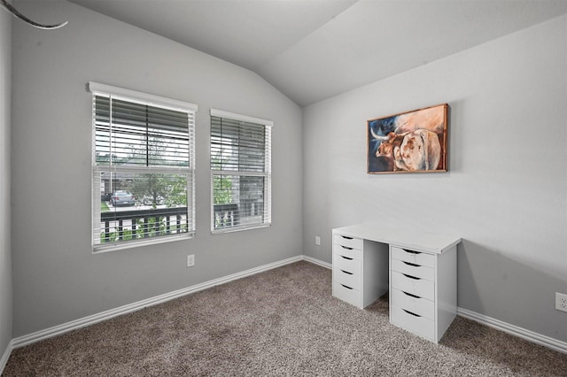 carpeted bedroom with vaulted ceiling