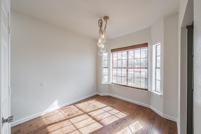 spare room featuring hardwood / wood-style flooring