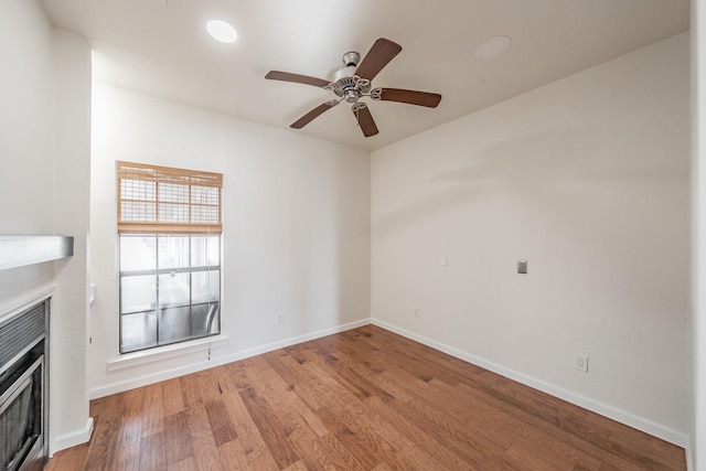 unfurnished living room featuring ceiling fan and light hardwood / wood-style floors