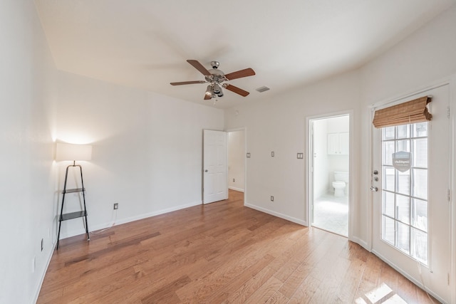 empty room featuring ceiling fan and light hardwood / wood-style floors