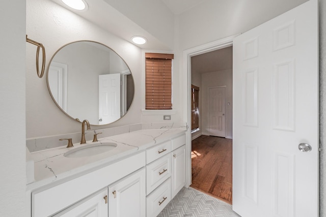 bathroom featuring vanity and wood-type flooring