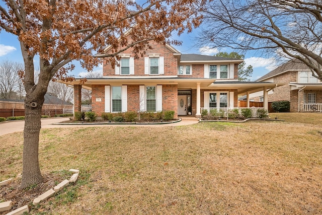 view of front of home with a porch and a front yard