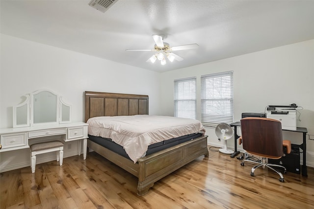 bedroom featuring ceiling fan and light hardwood / wood-style flooring