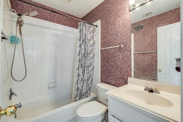 full bathroom featuring vanity, shower / bathtub combination with curtain, and toilet