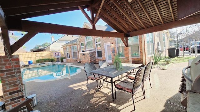 view of pool featuring a jacuzzi and a patio