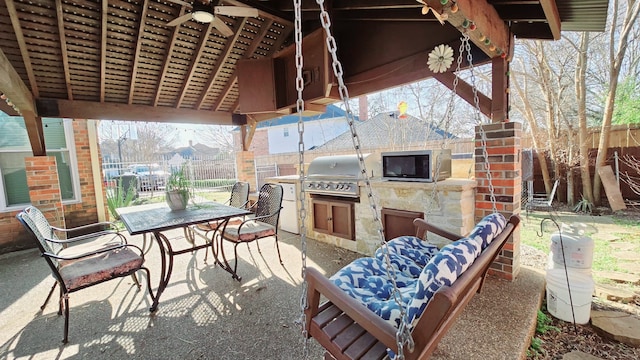 view of patio / terrace featuring exterior kitchen and grilling area