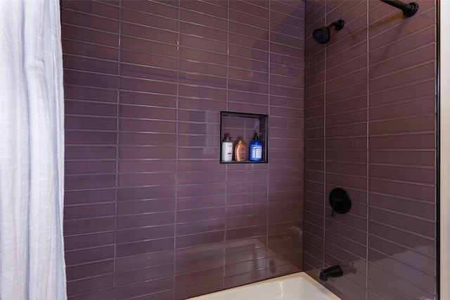 bathroom featuring shower / bath combo with shower curtain