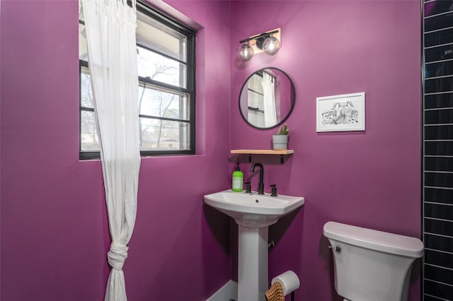 bathroom with sink and toilet