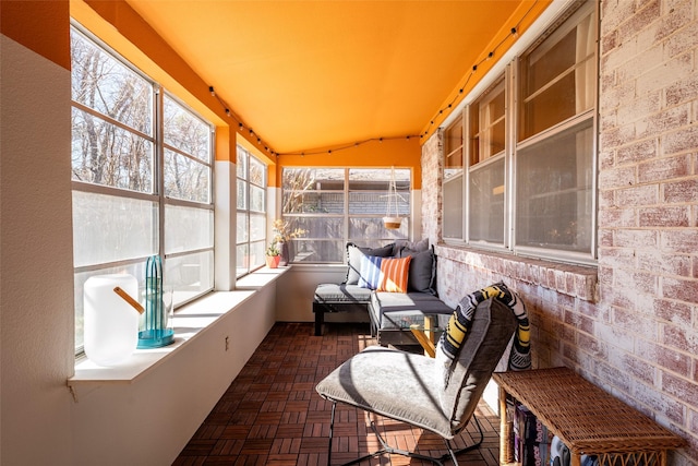 sunroom / solarium with lofted ceiling