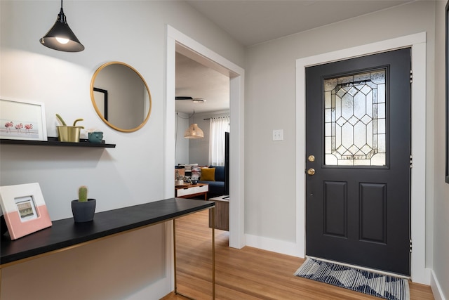 entryway with plenty of natural light and hardwood / wood-style floors