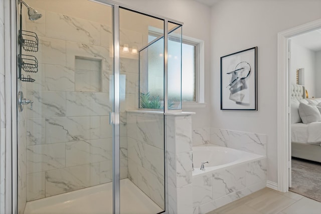 ensuite bathroom with a stall shower, a garden tub, and ensuite bathroom