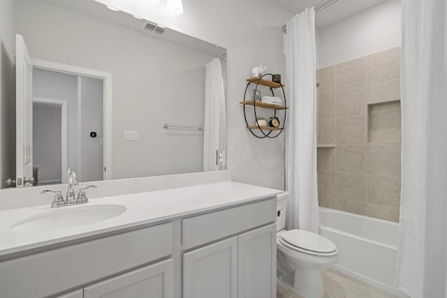 bathroom with visible vents, shower / bathtub combination with curtain, toilet, vanity, and tile patterned flooring