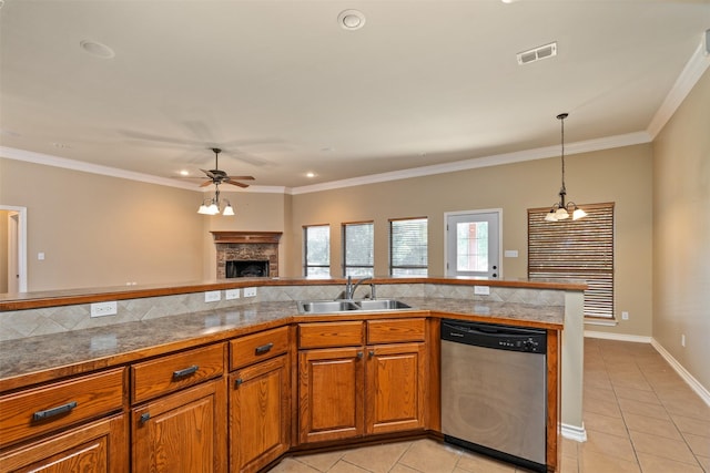 kitchen featuring light tile patterned flooring, a stone fireplace, sink, stainless steel dishwasher, and crown molding