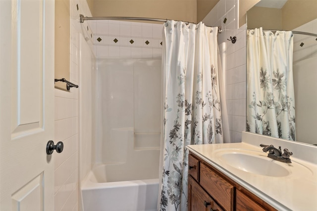 bathroom with shower / tub combo with curtain and vanity