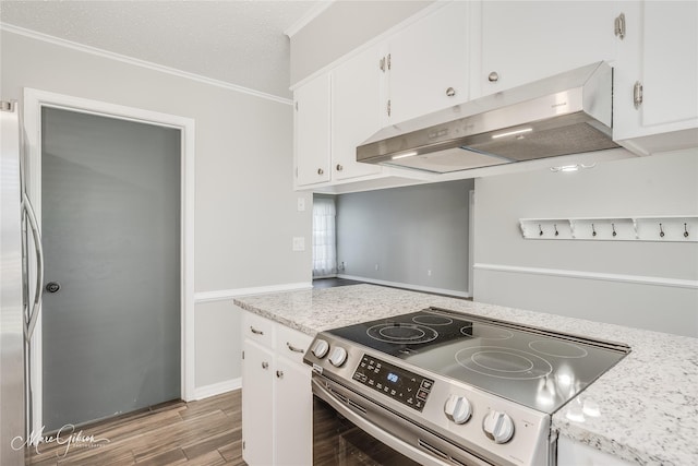 kitchen with hardwood / wood-style floors, electric range, and white cabinets