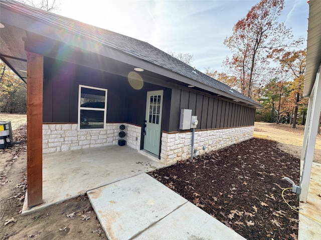 view of side of property featuring a patio area