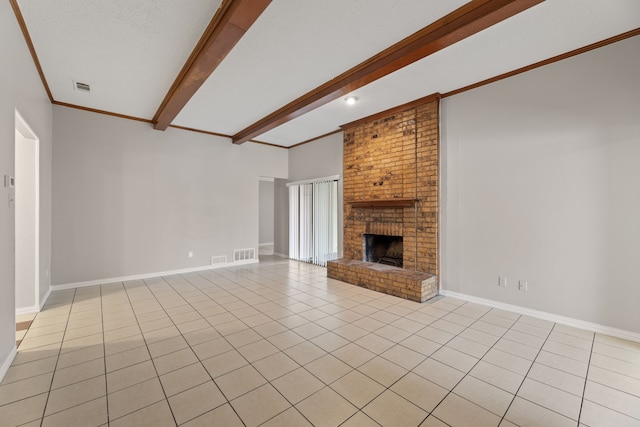 unfurnished living room featuring crown molding, a textured ceiling, a brick fireplace, light tile patterned floors, and beamed ceiling