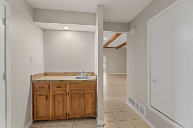 bathroom with vanity and tile patterned flooring