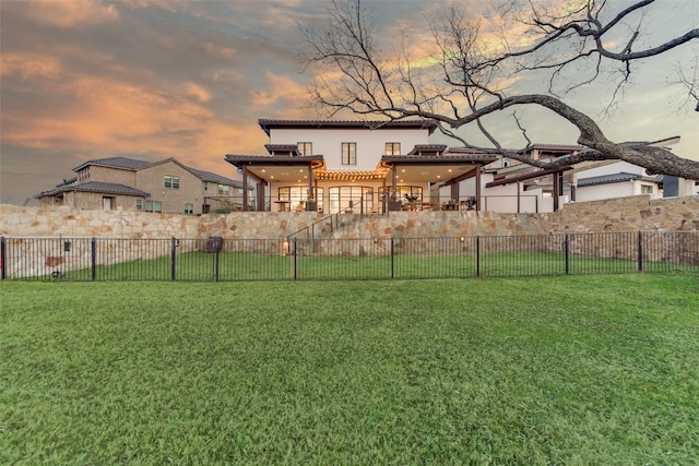 yard at dusk with a patio