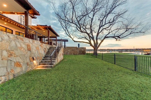 view of yard at dusk