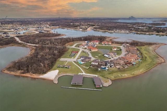 aerial view at dusk with a water view