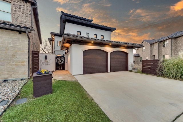 mediterranean / spanish-style home featuring a garage