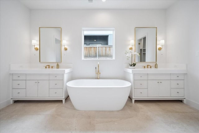 bathroom with vanity and a bathtub