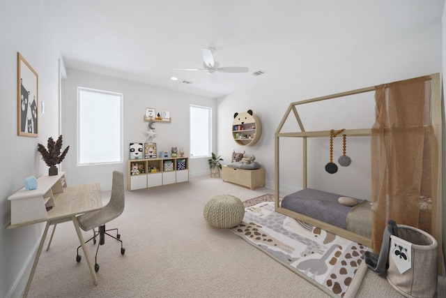 interior space featuring carpet floors and ceiling fan