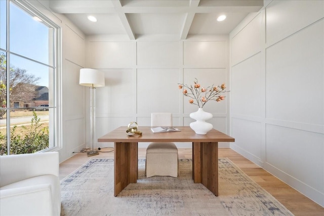 office with coffered ceiling, beam ceiling, light hardwood / wood-style flooring, and plenty of natural light