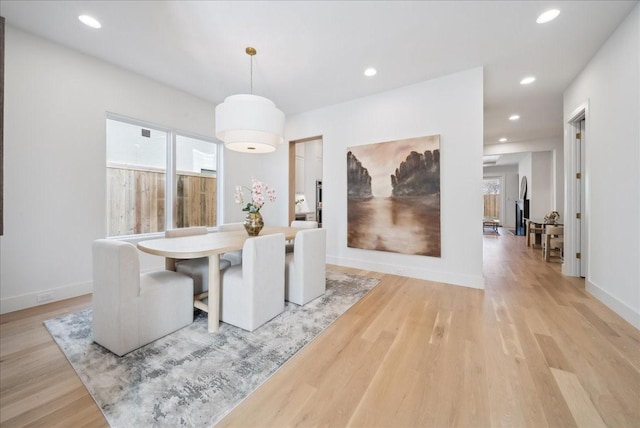 dining area with light wood-type flooring