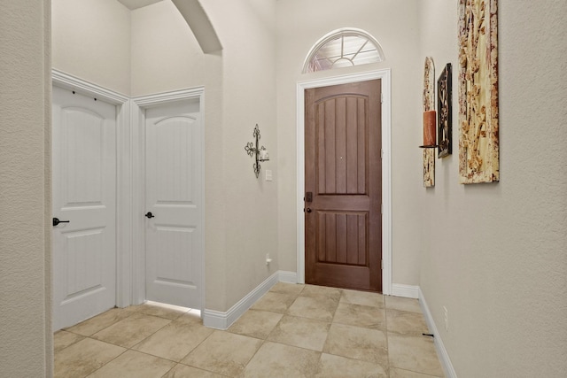 foyer with light tile patterned floors