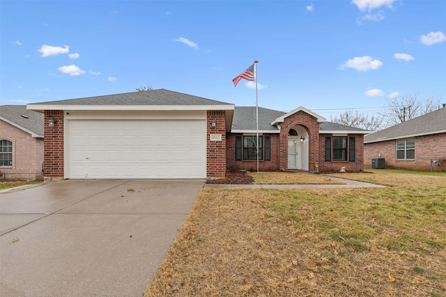 ranch-style home featuring a garage, central AC unit, and a front yard