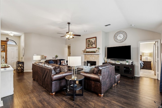 living room featuring lofted ceiling, dark hardwood / wood-style floors, and ceiling fan