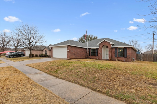 ranch-style home featuring a garage and a front lawn