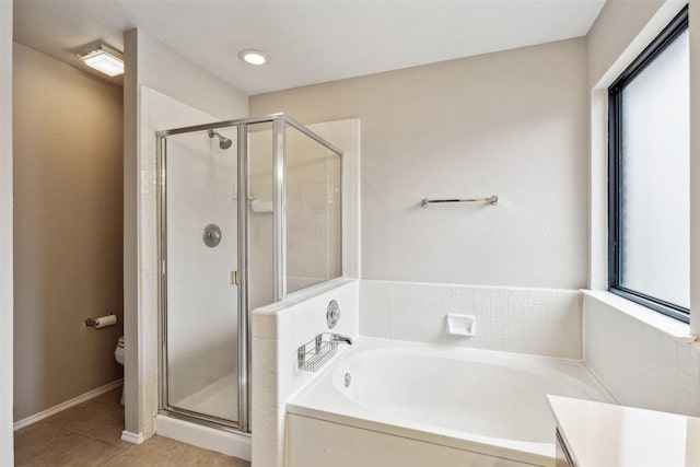 full bathroom featuring vanity, toilet, tile patterned floors, and plus walk in shower