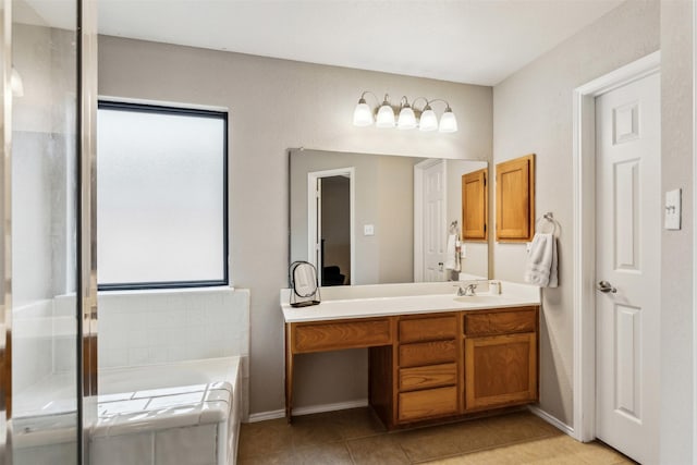 bathroom featuring tile patterned floors, vanity, and a bathtub