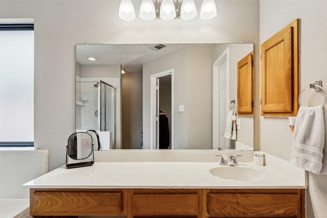 bathroom with vanity and an enclosed shower