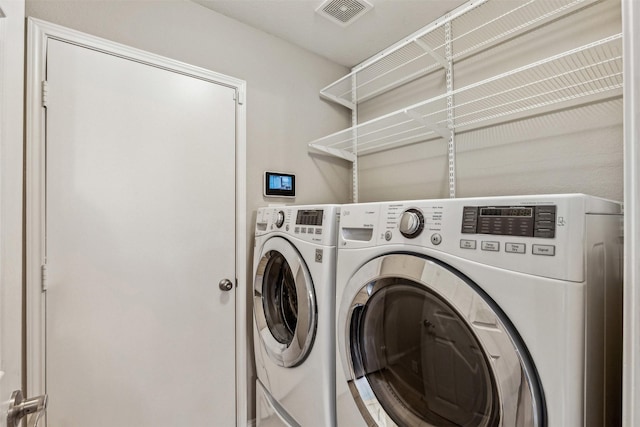 laundry area featuring washer and clothes dryer