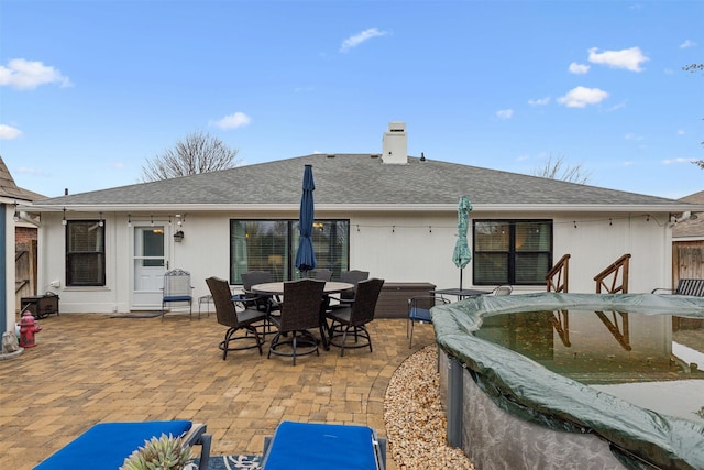 rear view of house with a patio