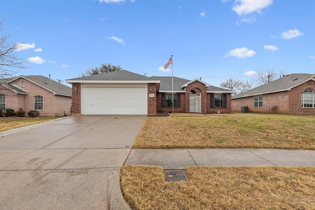 ranch-style home featuring a garage, central AC unit, and a front lawn