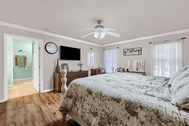 bedroom featuring ceiling fan, ornamental molding, ensuite bathroom, and light hardwood / wood-style floors