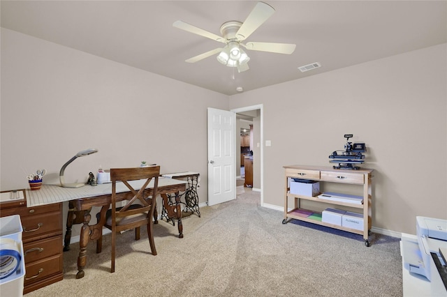 office featuring ceiling fan and light colored carpet