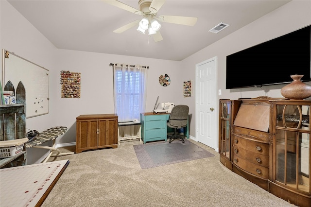 home office featuring ceiling fan and carpet