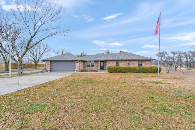 single story home featuring a garage and a front lawn