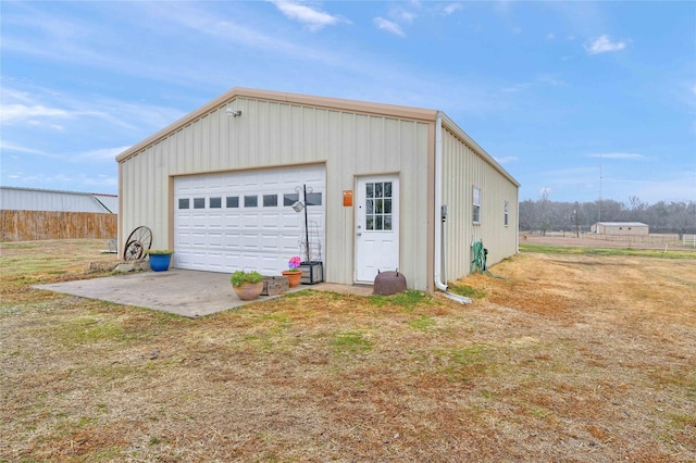 garage with a lawn