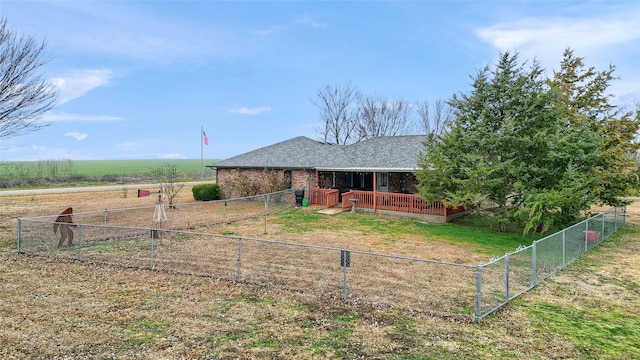 view of yard with a rural view and a wooden deck