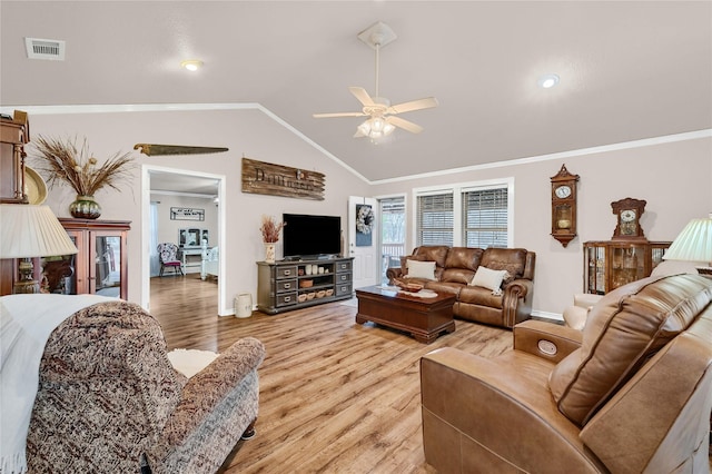 living room featuring ceiling fan, ornamental molding, light hardwood / wood-style floors, and vaulted ceiling